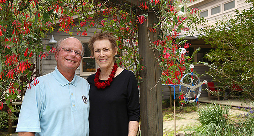 Ralph and Nancy Raasch in the front yard of their home in Carrboro.