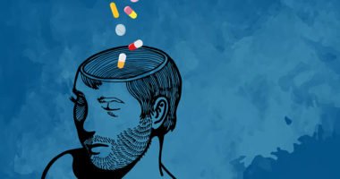 Illustration of a man on a blue background with colorful pills falling into his open head.