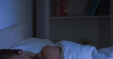 a woman in bed, sound asleep