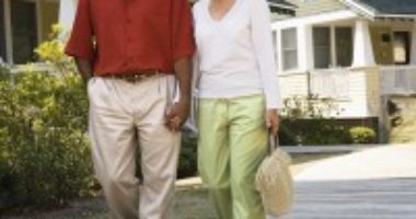 a middle-aged couple walkng together