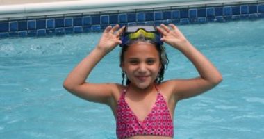 Girl having fun in a swimming pool