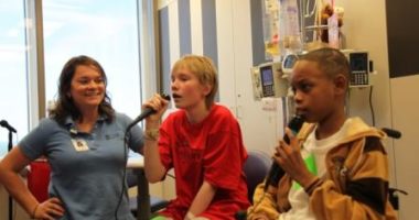 Music therapist Elizabeth Fawcett works with two patients at North Carolina Children's Hospital.