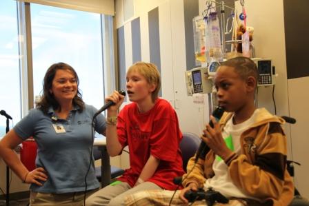 Music therapist Elizabeth Fawcett works with two patients at North Carolina Children's Hospital.