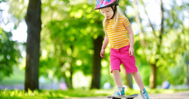 Image of little girl skateboarding