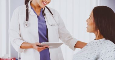Female doctor talking to female patient