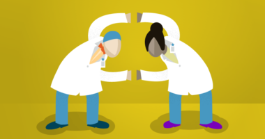 Two urgent care doctors linking arms.