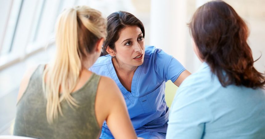 Cancer navigator comforting patient