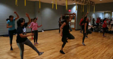 Instructor and participants at a Masala Bhangra fitness class