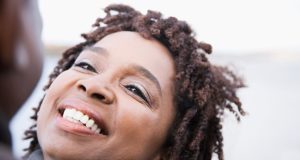 close-up of older woman looking up at a partner