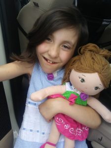 Avery holding her baby doll