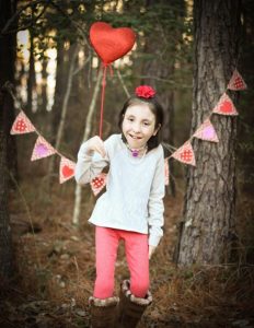 Photo of Avery at a Valentine's Day-themed shoot