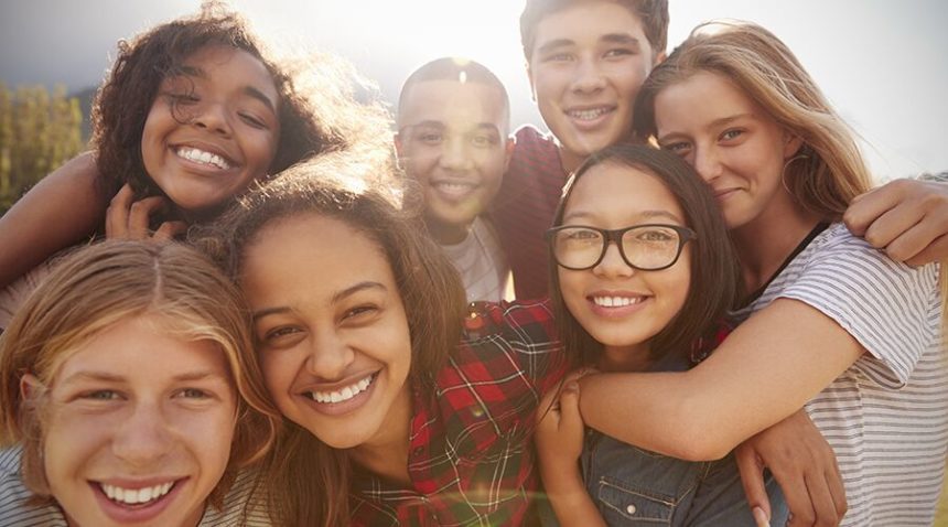 group of teenagers smiling at camera