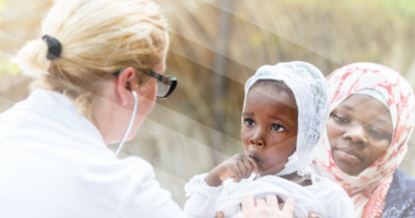 Photo of a doctor examining a young child