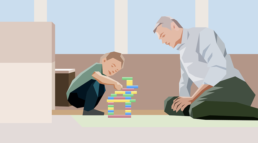 A young child stacks blocks while a adult male observes him.