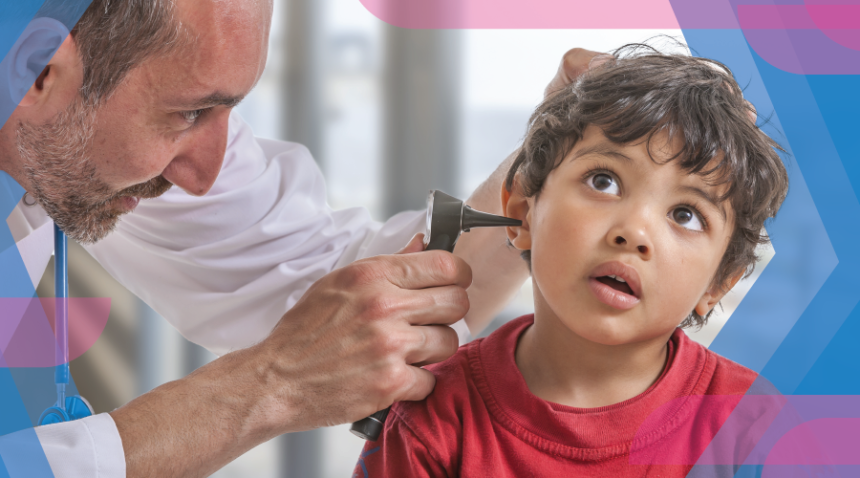 Photo of a doctor looking inside a child's ear.
