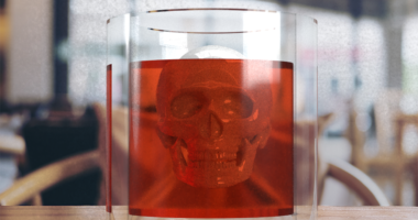 Photo illustration of an alcoholic drink with a skull inside.