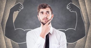 Man thinking with drawing of muscles behind him.