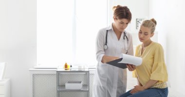 Patient having appointment with doctor in hospital