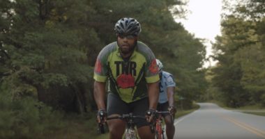 UNC patient Victor Texiera rides his bike on a rural road