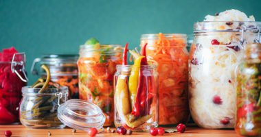 A photograph of jars with pickled vegetables.