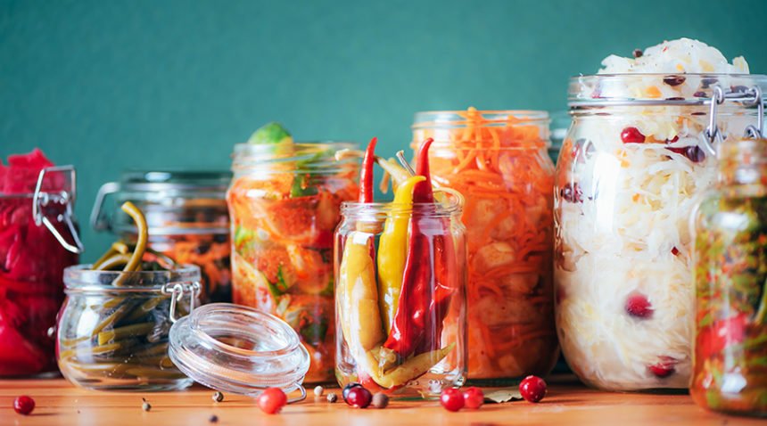 A photograph of jars with pickled vegetables.