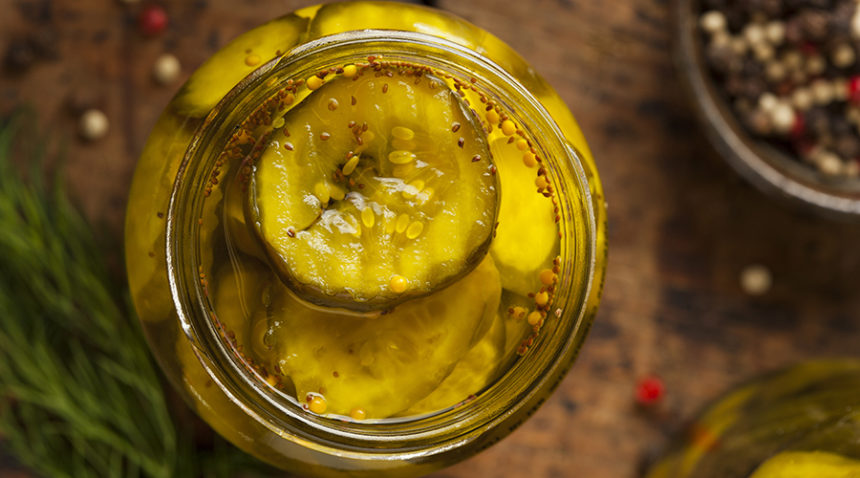 A photograph of a jar of pickles.