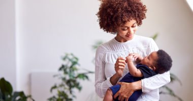 Mother holds infant son