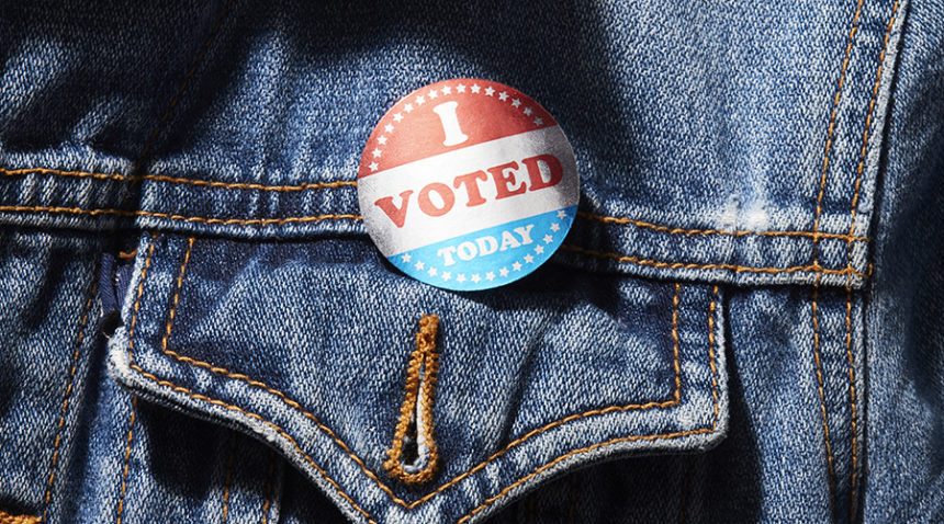 "I voted today" button pinned on a jean jacket