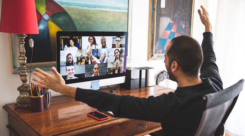 Man in Video call with friends and relatives in front of computer