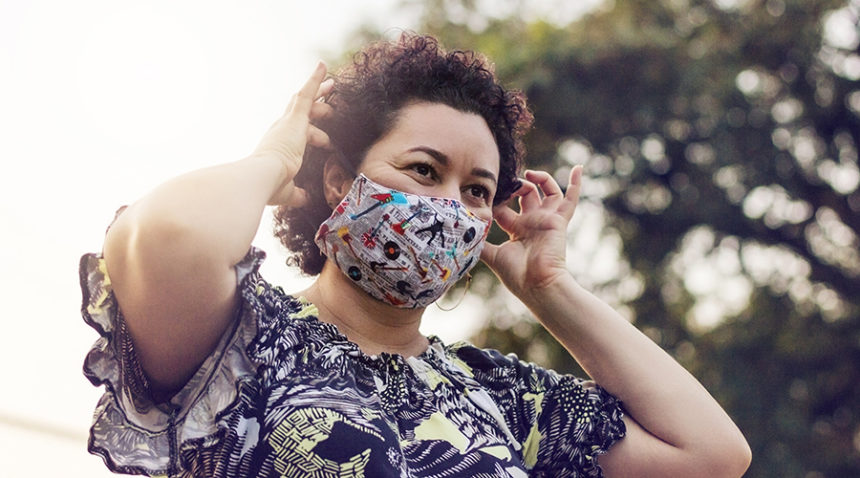 woman wears cloth mask outside