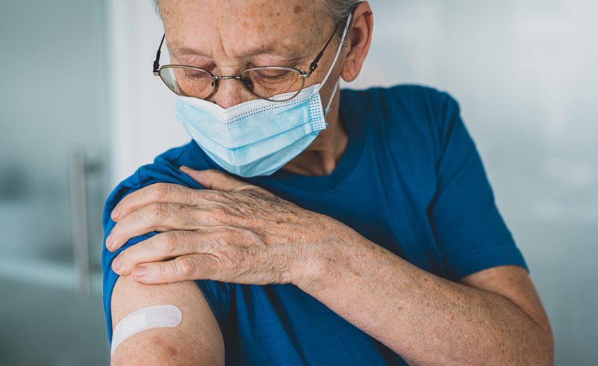 Older woman after receiving a vaccine