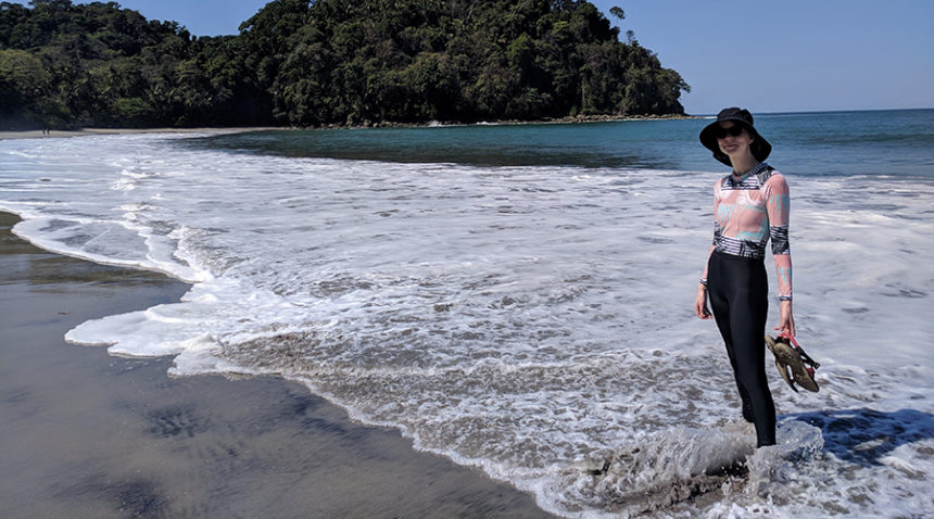 UNC cancer patient Katy standing on a tropical beach