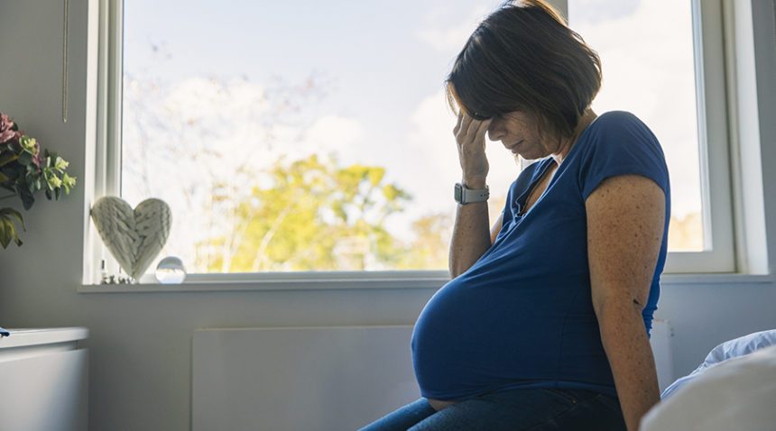 pregnant woman suffering from being tired and lack of sleep