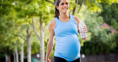 Pregnant woman exercising outside