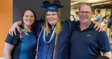 UNC Health stroke patient Kathy with her husband and daughter at her daughter's graduation
