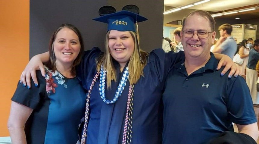 UNC Health stroke patient Kathy with her husband and daughter at her daughter's graduation
