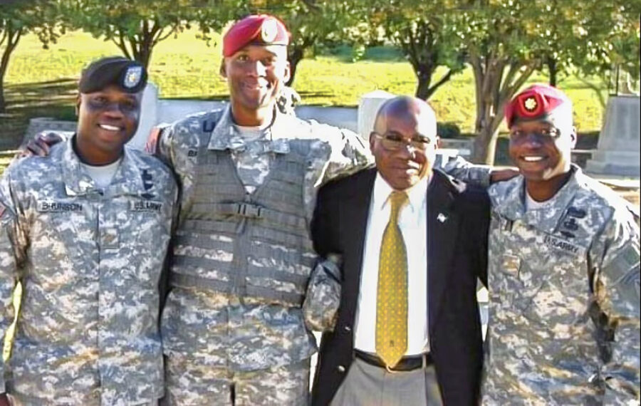 Albert Brunson and his three sons, all in army uniforms