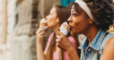 Two women eating and enjoying ice cream cones