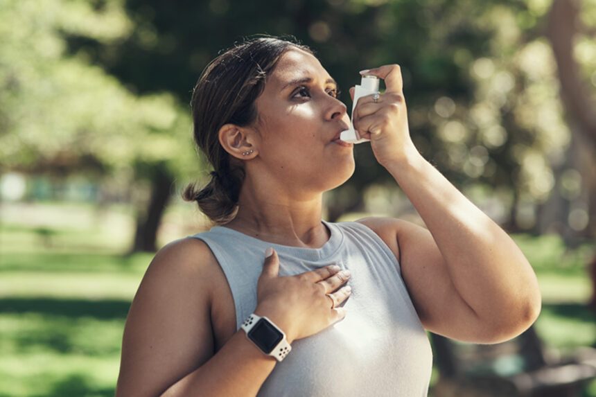 Runner using asthma inhaler