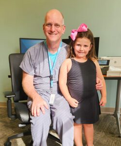 Dr. Goodnight with Emma now, a thriving kindergartener