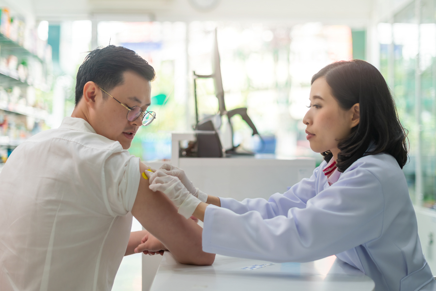 Provider administers a vaccine to a patient