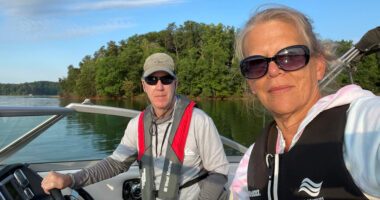 Susan and her husband enjoy a boat ride on the lake.