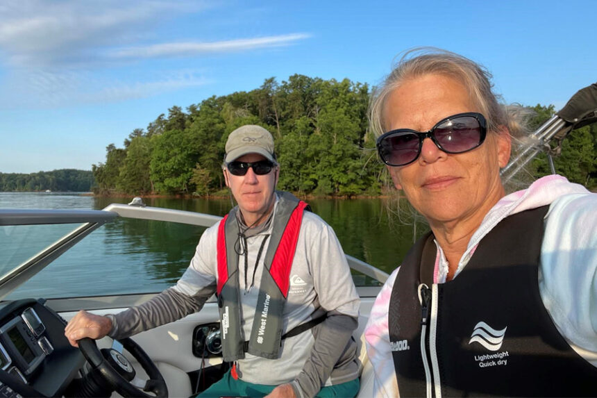Susan and her husband enjoy a boat ride on the lake.