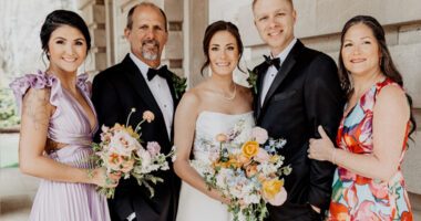 Susan celebrates a special moment with her family at a wedding.