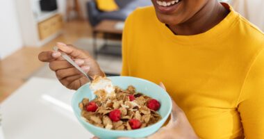 Woman eats a healthy bowl of fibrous food
