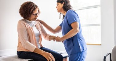 Provider looks at patient's shoulder