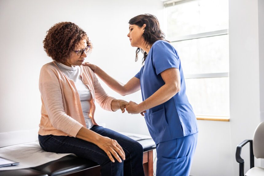 Provider looks at patient's shoulder